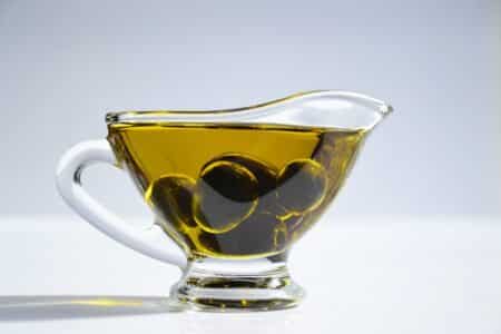 Olive Oil in an Open Sauce Pitcher