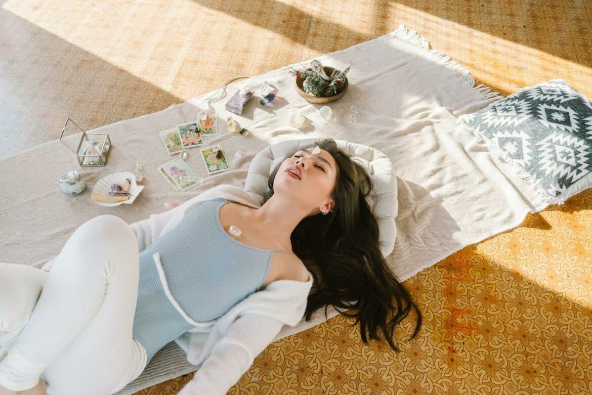 A Woman Lying Down on a White Cloth on the Floor